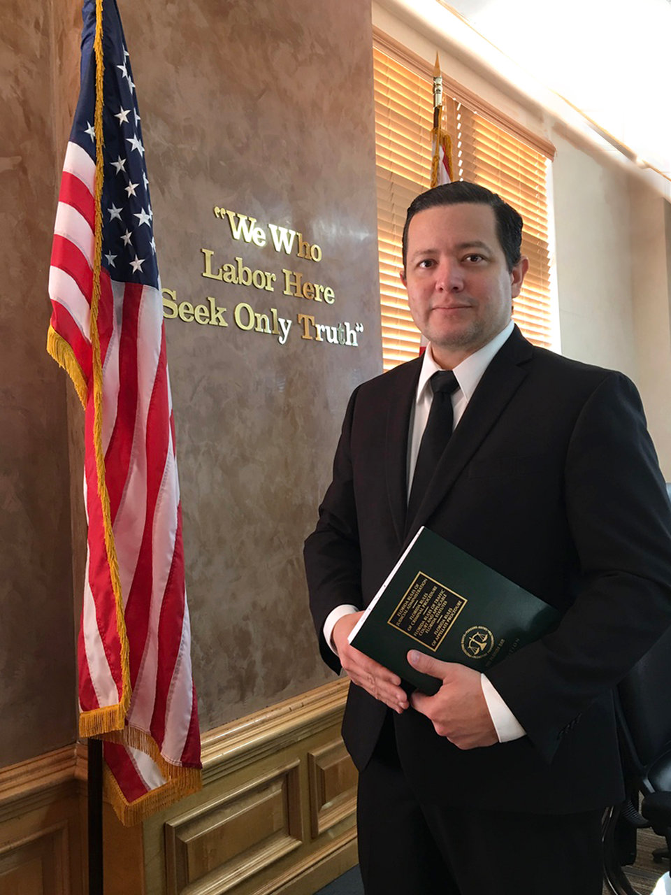 Harold A. Caicedo, Esq. at the courthouse in Lehigh Acres, Florida